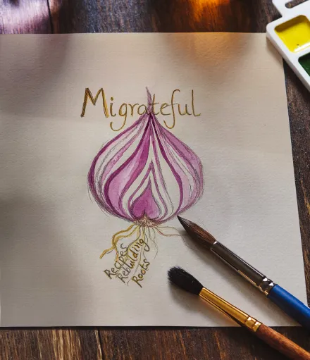 A drawing of an onion with the word migrateful written on it.